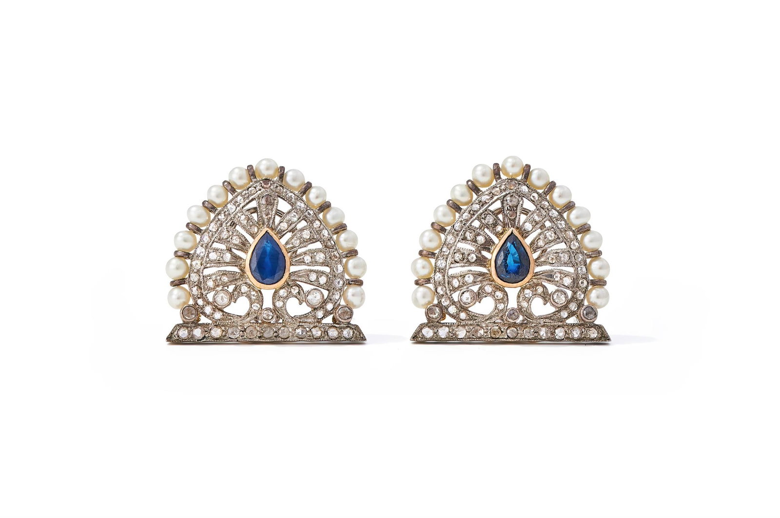 A PAIR OF SAPPHIRE, DIAMOND AND CULTURED PEARL PANEL EARRINGS: A PAIR OF SAPPHIRE, DIAMOND AND CULTURED PEARL PANEL EARRINGS The pierced acanthus leaf panels set with rose cut diamonds and a central pear cut sapphire, cultured pearl borders, unmarked