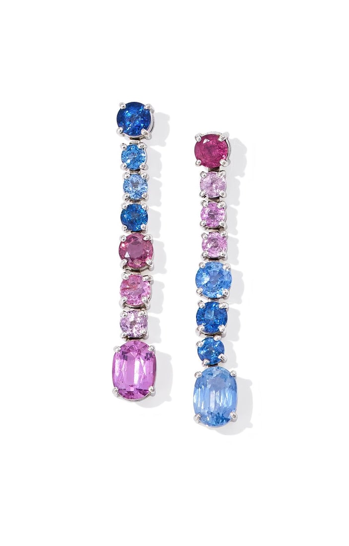 A PAIR OF SAPPHIRE AND PINK SAPPHIRE PENDENT EARRINGS: A PAIR OF SAPPHIRE AND PINK SAPPHIRE PENDENT EARRINGSOf opposing design, suspending either an oval cut sapphire or pink sapphire, to a circular cut sapphire and pink sapphire line surmount, post