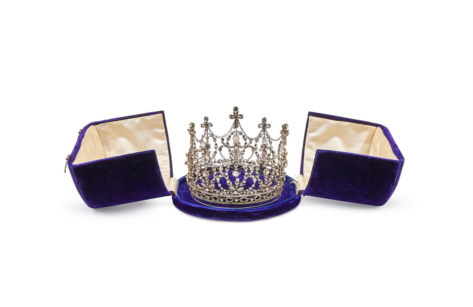 A LATE 19TH CENTURY PASTE AND DIAMOND CORONET: A LATE 19TH CENTURY PASTE AND DIAMOND CORONETOf wreath and ribbon design, connected by spectacle set paste chains, to a ribbon bow band, set throughout with circular cut paste, old and rose cut diamon