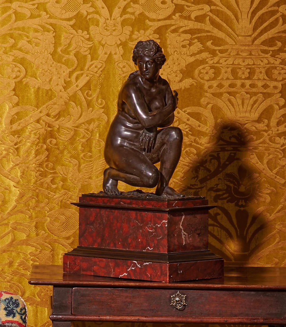 AFTER GIAMBOLOGNA, A BRONZE FIGURE OF THE CROUCHING VENUS, FRENCH OR ITALIAN, MID 19TH CENTURY: AFTER GIAMBOLOGNA, A BRONZE FIGURE OF THE CROUCHING VENUS FRENCH OR ITALIAN, MID 19TH CENTURY Set on a bronze mounted Rouge Griotte marble base 55cm high overall, the base 32.5cm wide
