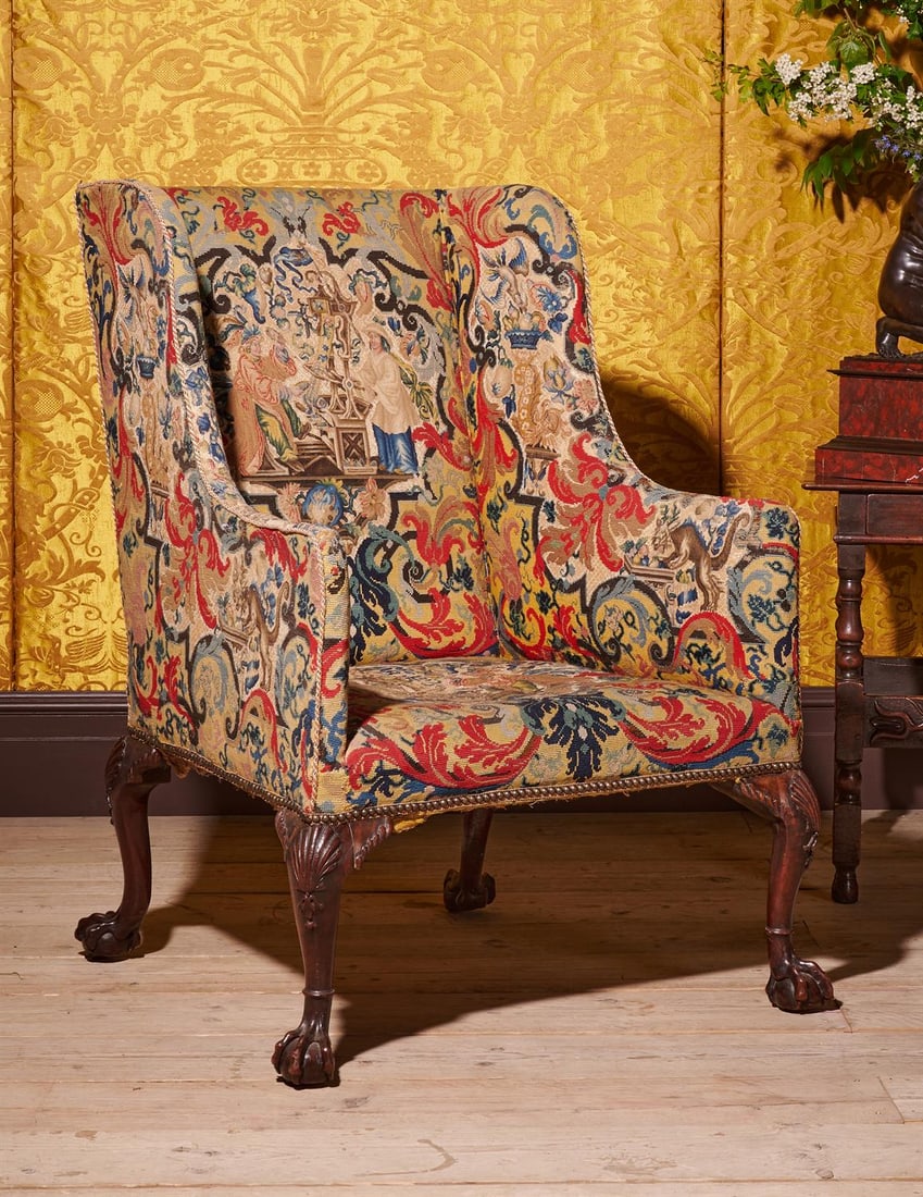 A FINE GEORGE II CARVED MAHOGANY AND NEEDLEWORK UPHOLSTERED WING ARMCHAIR, CIRCA 1740: A FINE GEORGE II CARVED MAHOGANY AND NEEDLEWORK UPHOLSTERED WING ARMCHAIRATTRIBUTED TO WILLIAM HALLETT, CIRCA 1740109cm high, 82.5cm wide, 84cm deepProvenance:Possibly acquired for Hanbury Hall, Worce