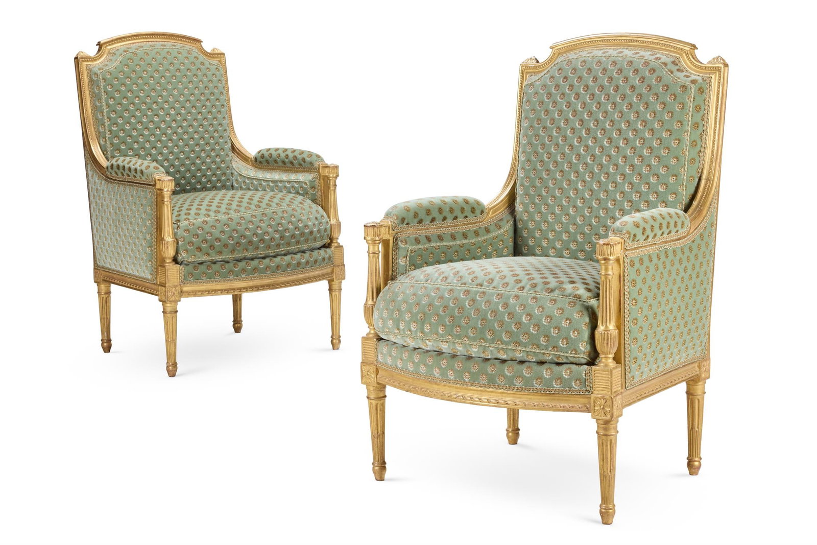 ‡ A PAIR OF LOUIS XVI GILTWOOD BERGÈRE ARMCHAIRS, CIRCA 1775: ‡ A PAIR OF LOUIS XVI GILTWOOD BERGÈRE ARMCHAIRSIN THE MANNER OF LOUIS-MAGDELEINE PLUVINET, CIRCA 1775 Upholstered in green moquette103cm high, 68cm wide, 67cm deepProvenance:The Collection