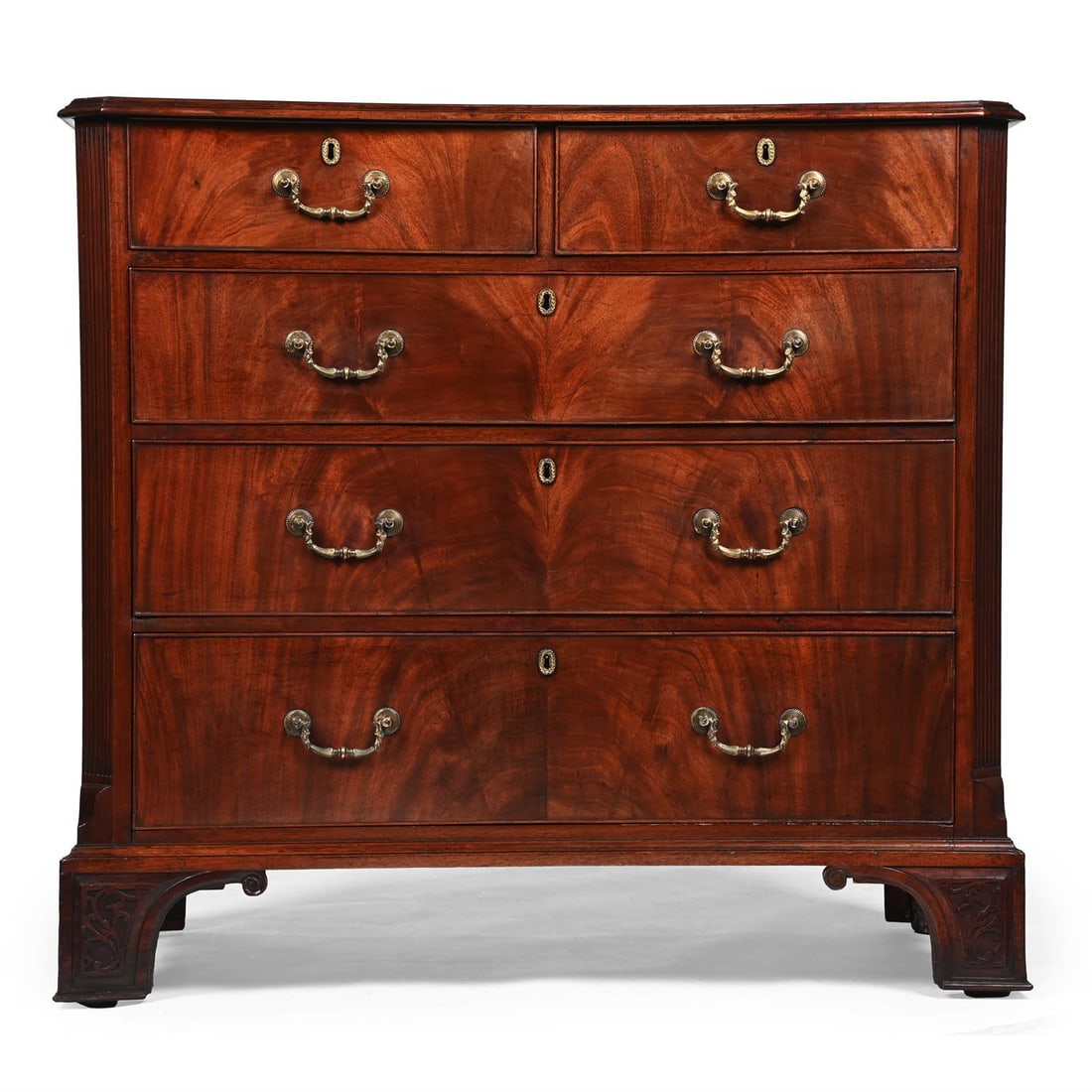 A GEORGE III MAHOGANY CHEST OF DRAWERS, IN THE MANNER OF THOMAS CHIPPENDALE, CIRCA 1760 (1 of 3)
