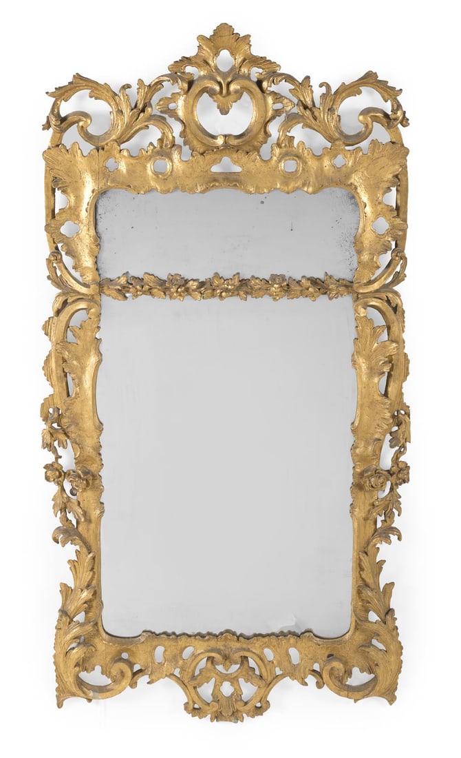 A GEORGE III CARVED GILTWOOD MIRROR, IN THE MANNER OF THOMAS CHIPPENDALE, CIRCA 1770 (1 of 2)