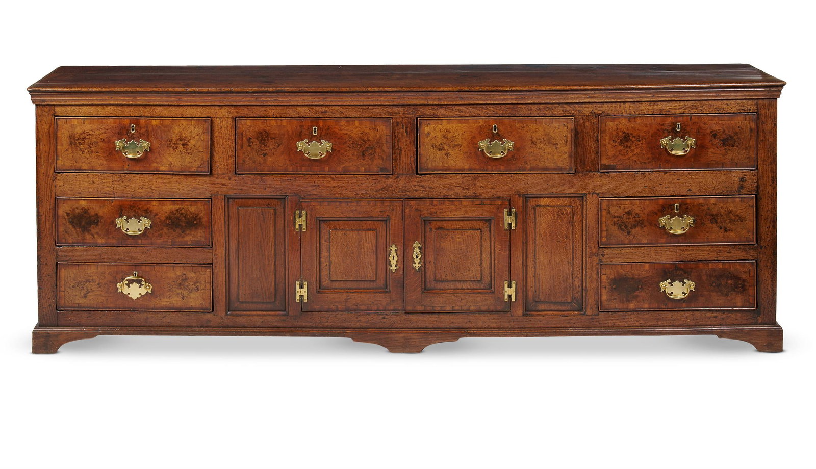 A GEORGE III OAK AND BURR OAK DRESSER BASE, CIRCA 1780 (1 of 3)
