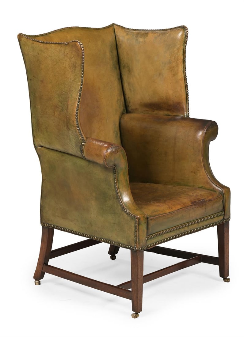 A GEORGE III MAHOGANY, BRASS STUDDED AND GREEN LEATHER UPHOLSTERED WING ARMCHAIR, CIRCA 1780 (1 of 3)