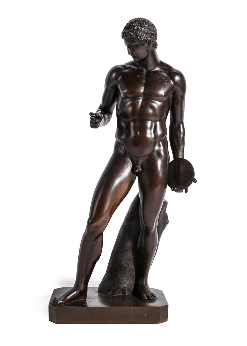 AFTER THE ANTIQUE, A BRONZE FIGURE OF THE DISCOPHOROS, FRENCH, MID TO LATE 19TH CENTURY: AFTER THE ANTIQUE, A BRONZE FIGURE OF THE DISCOPHOROS FRENCH, MID TO LATE 19TH CENTURY The athlete depicted carrying a disc in his left hand 35cm high, the base 14cm wide