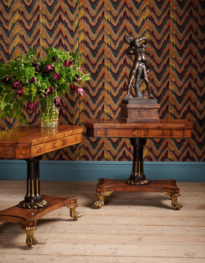 Y A PAIR OF REGENCY ROSEWOOD, SATINWOOD CROSSBANDED AND BRONZE MOUNTED CARD TABLES, CIRCA 1820: Y A PAIR OF REGENCY ROSEWOOD, SATINWOOD CROSSBANDED AND BRONZE MOUNTED CARD TABLES AFTER THE DESIGN BY MARSH & TATHAM, IN THE MANNER OF HENRY HOLLAND, CIRCA 1820 With an ebonised stem and marquetry th