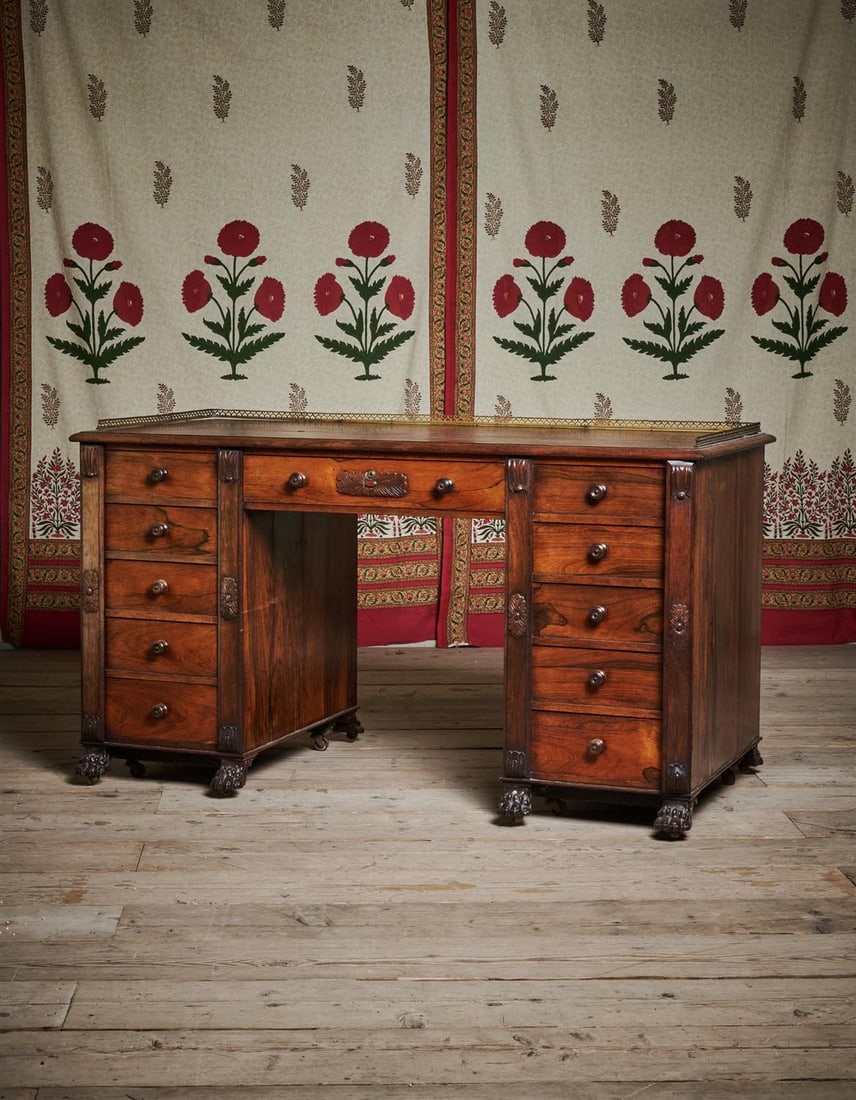Y A REGENCY ROSEWOOD AND GILT METAL MOUNTED KNEEHOLE DESK, AFTER DESIGNS BY THOMAS HOPE, CIRCA 1815 (1 of 4)