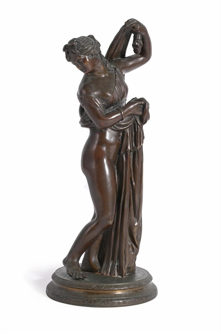 AFTER THE ANTIQUE, A BRONZE FIGURE OF VENUS CALLIPYGE, LATE 19TH CENTURY: AFTER THE ANTIQUE, A BRONZE FIGURE OF VENUS CALLIPYGE POSSIBLY SOMMER FOUNDRY NAPLES, LATE 19TH CENTURY Depicted standing on a circular plinth 27cm high, the base 11cm diameterAlso known as 'Venus aux