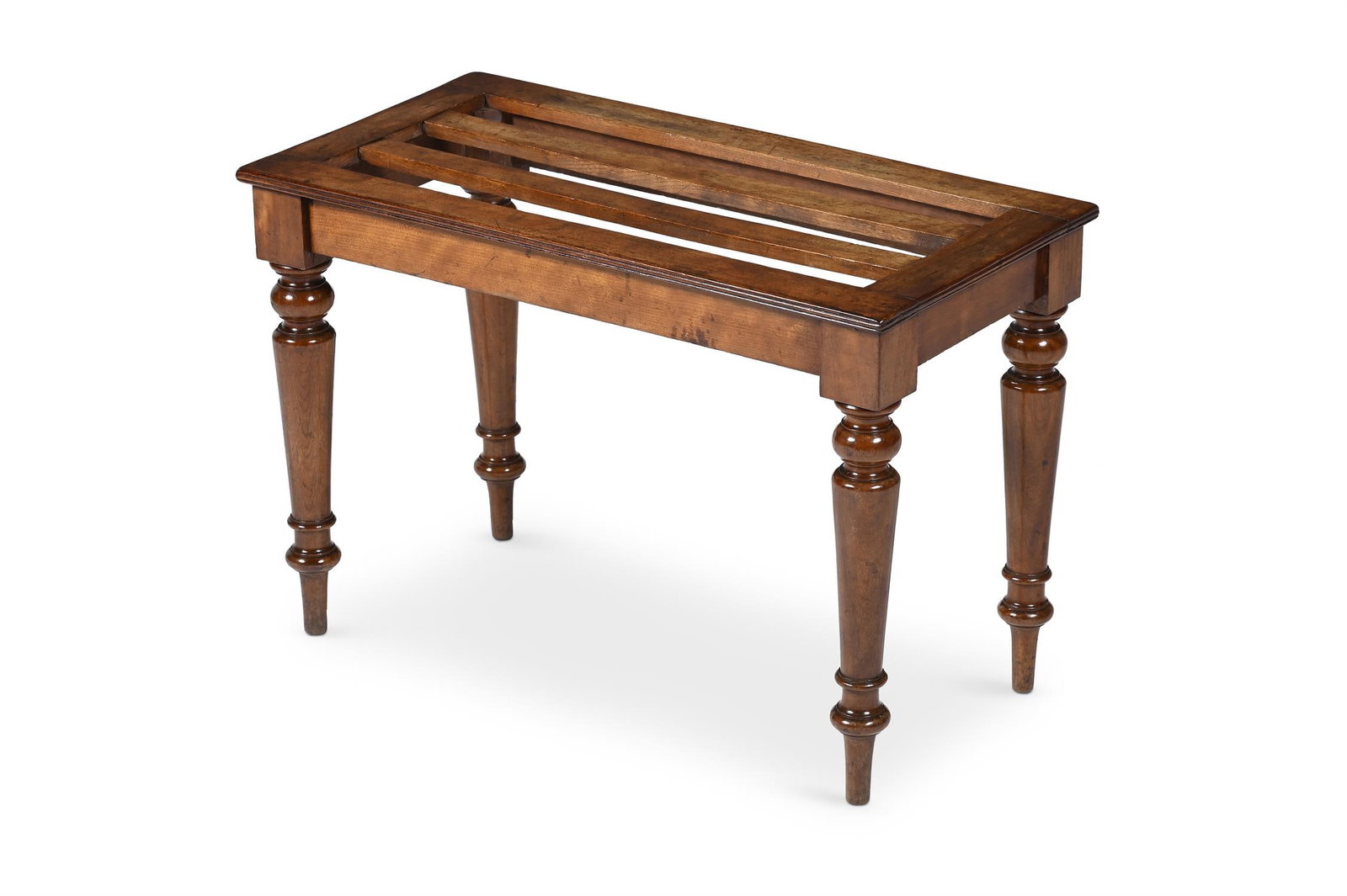 A GEORGE IV WALNUT LUGGAGE STAND, IN THE MANNER OF GILLOWS, CIRCA 1825 (1 of 3)