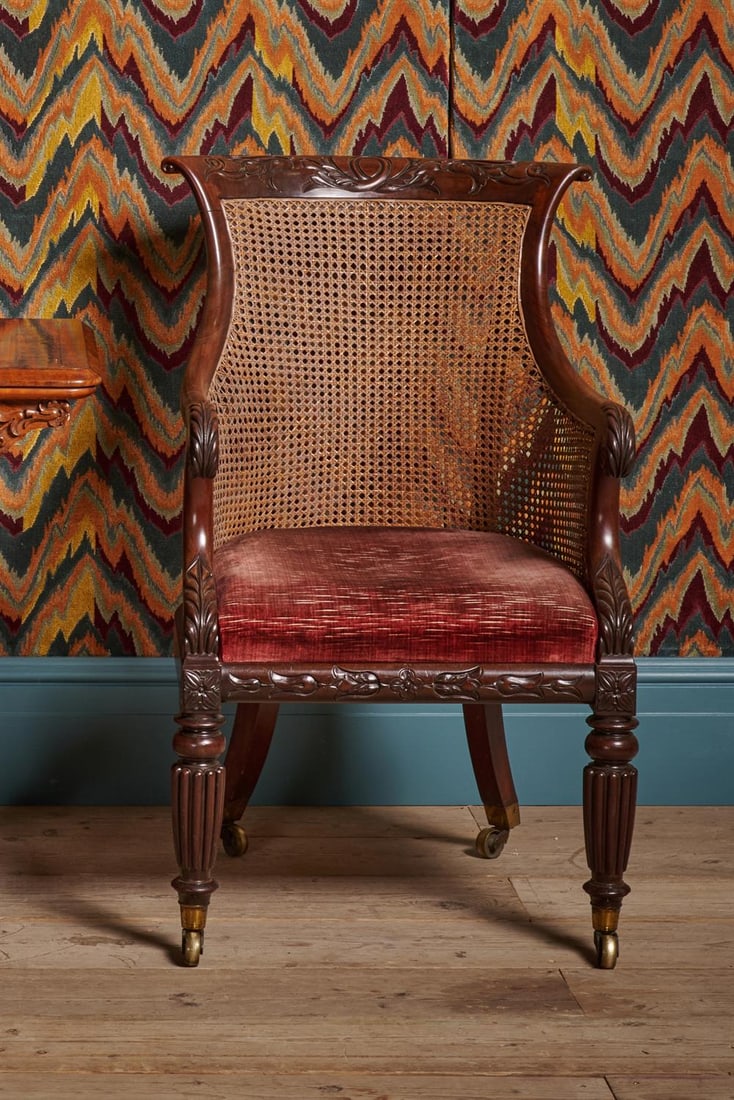 A REGENCY MAHOGANY LIBRARY BERGERE ARMCHAIR, ATTRIBUTED TO GILLOWS, CIRCA 1815 (1 of 5)