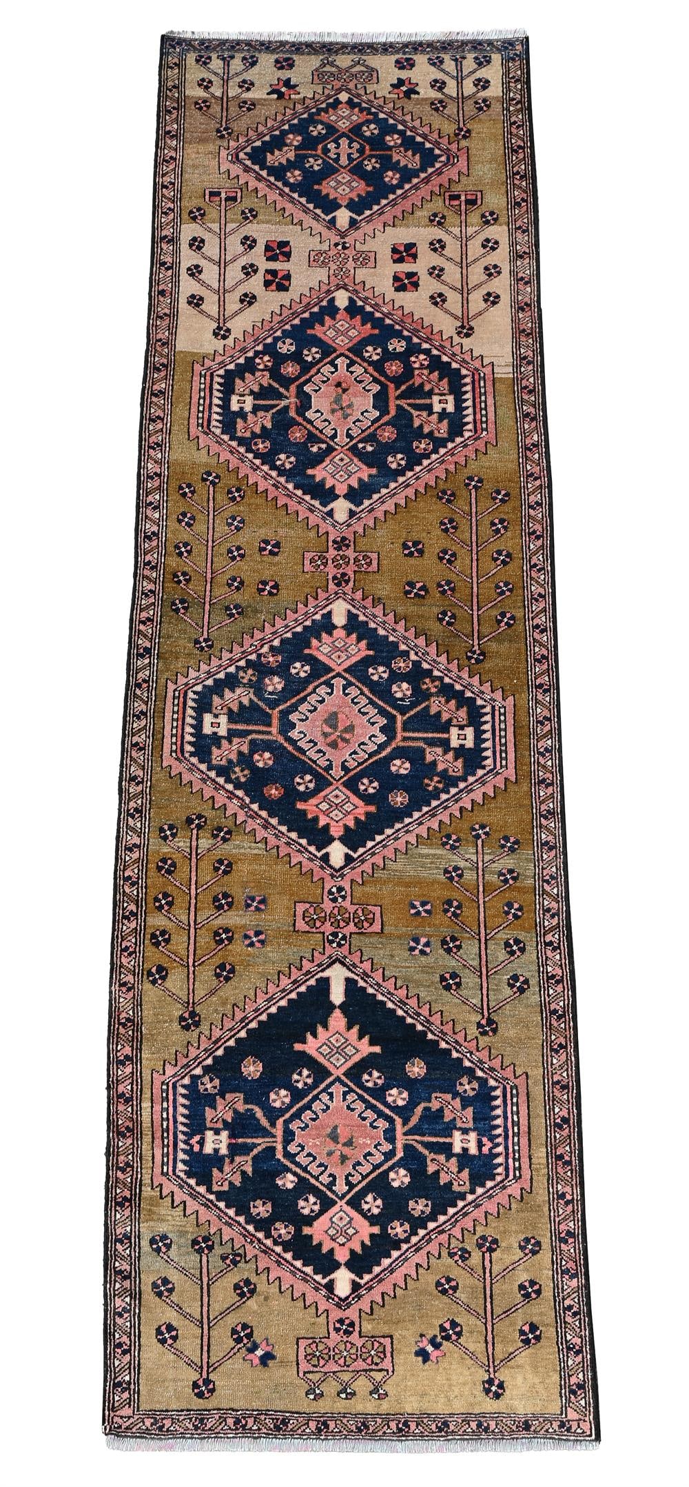 A NORTH WEST PERSIAN RUNNER: A NORTH WEST PERSIAN RUNNERapproximately 310 x 88cm
