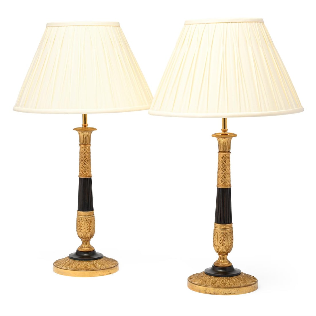 A PAIR OF GILT AND PATINATED BRONZE CANDLESTICK TABLE LIGHTS, EARLY 19TH CENTURY (1 of 2)