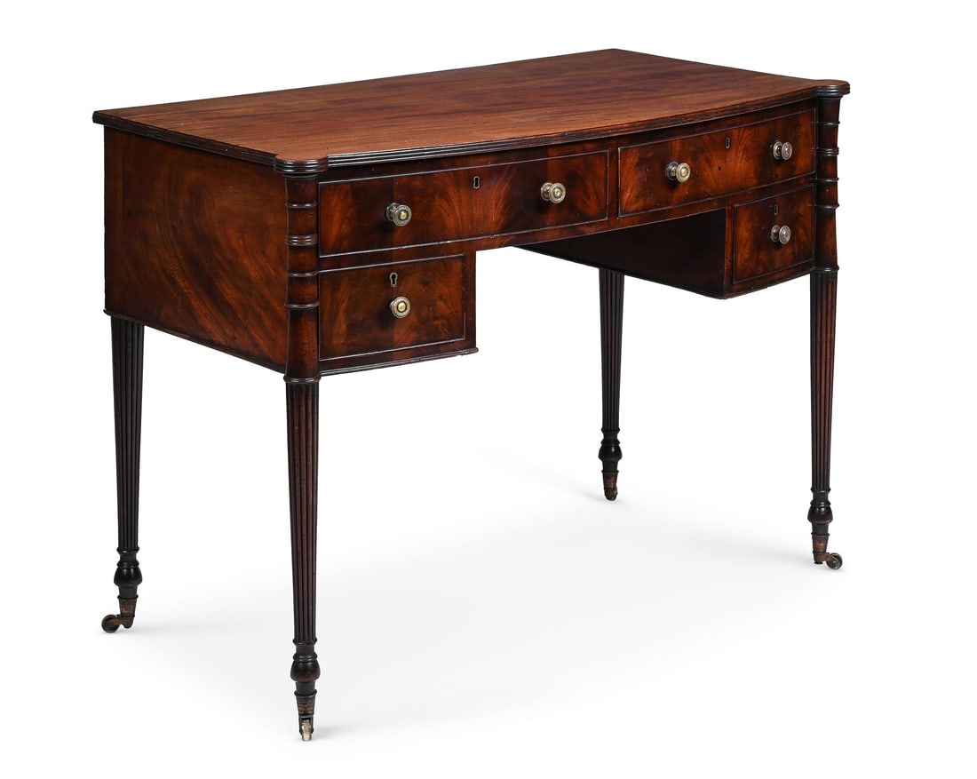 A REGENCY MAHOGANY BOWFRONT SIDE OR DRESSING TABLE, IN THE MANNER OF GILLOWS, CIRCA 1820 (1 of 6)