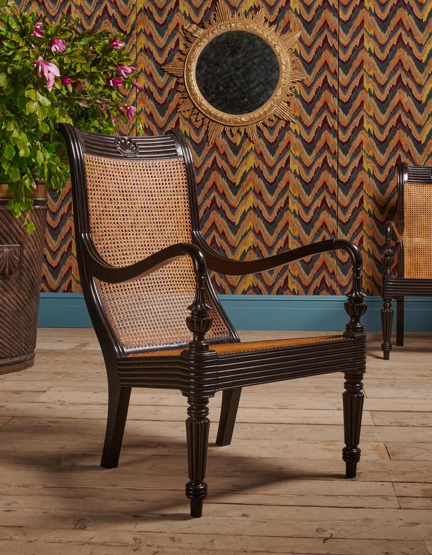 Y A CLOSELY MATCHED PAIR OF CEYLONESE CARVED EBONY ARMCHAIRS, FIRST HALD 19TH CENTURY (1 of 5)