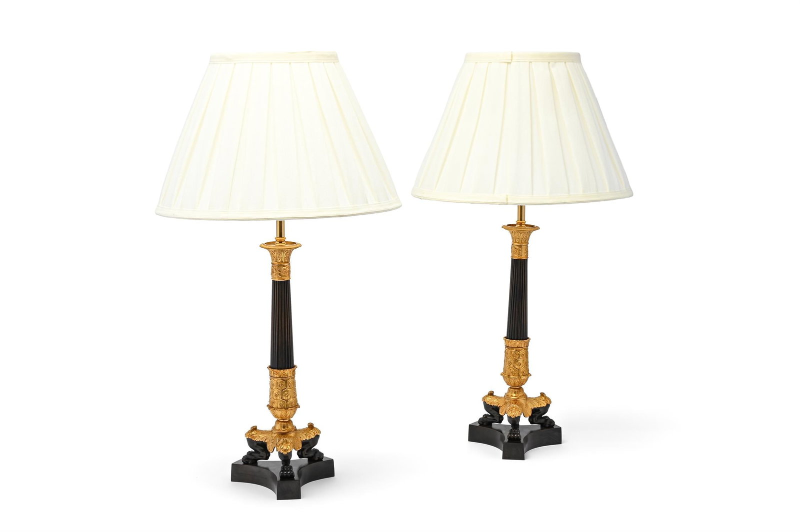 A PAIR OF GILT AND PATINATED BRONZE CANDLESTICK TABLE LIGHTS, EARLY 19TH CENTURY (1 of 2)