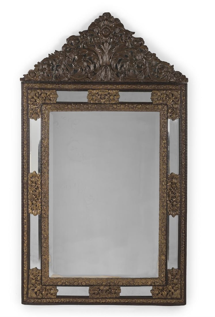 A LARGE FLEMISH REPOUSSE BRASS AND EBONISED MIRROR, 19TH CENTURY: A LARGE FLEMISH REPOUSSE BRASS AND EBONISED MIRROR19TH CENTURYWith marginal mirror plates196cm high, 115cm wide