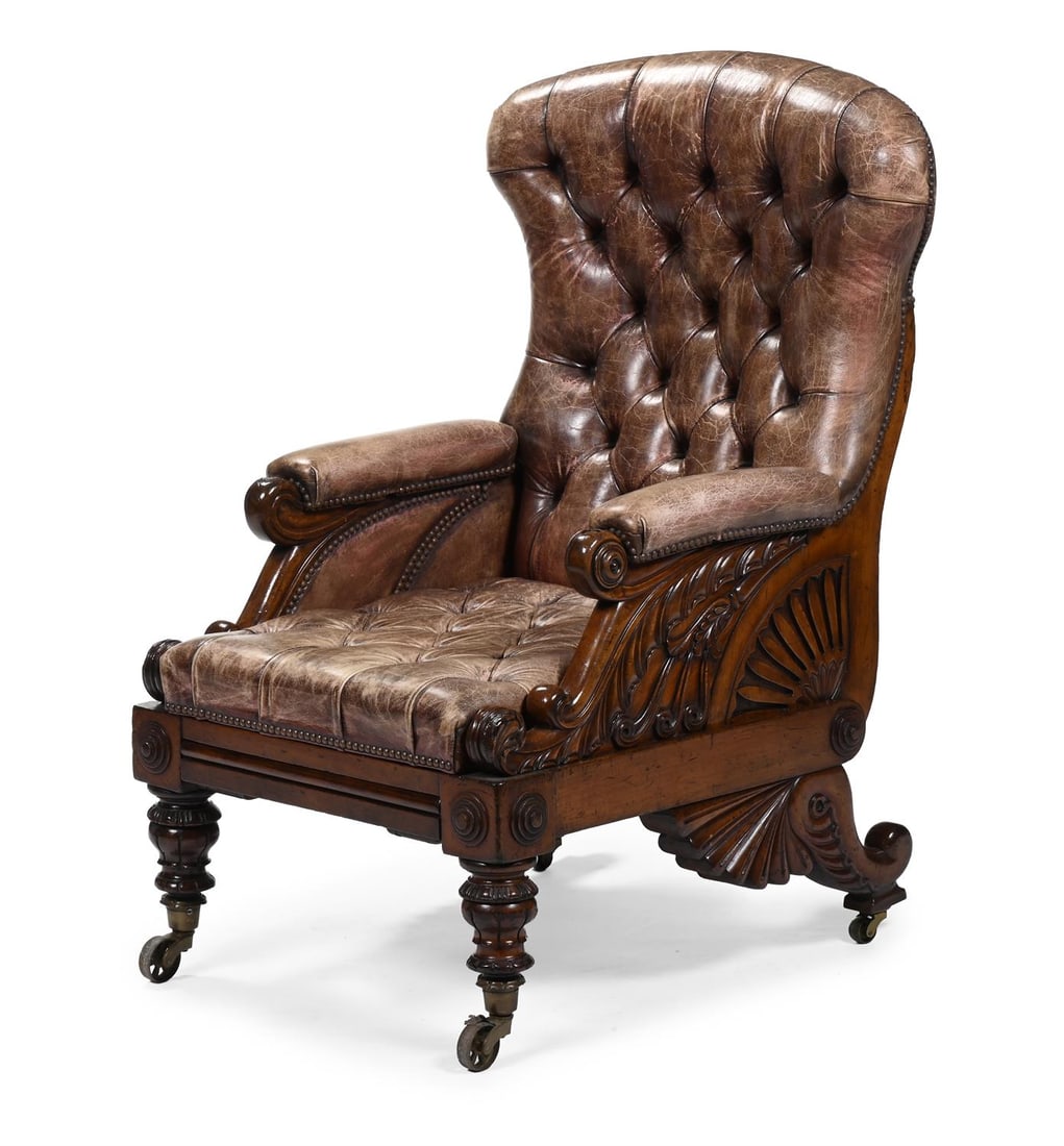 A VICTORIAN CARVED MAHOGANY AND BUTTONED LEATHER UPHOLSTERED LIBRARY ARMCHAIR, CIRCA 1850 (1 of 3)