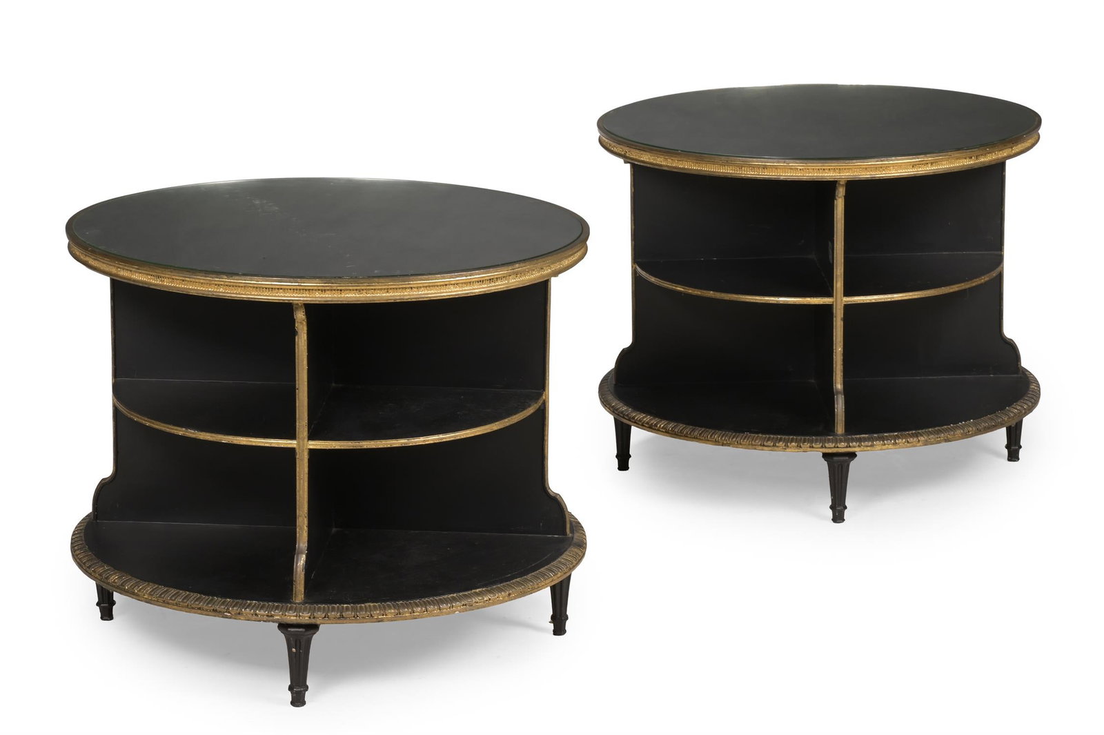 A PAIR OF EBONISED AND PARCEL GILT CIRCULAR LOW OCCASIONAL TABLES OR BOOKCASES, MID 20TH CENTURY (1 of 3)