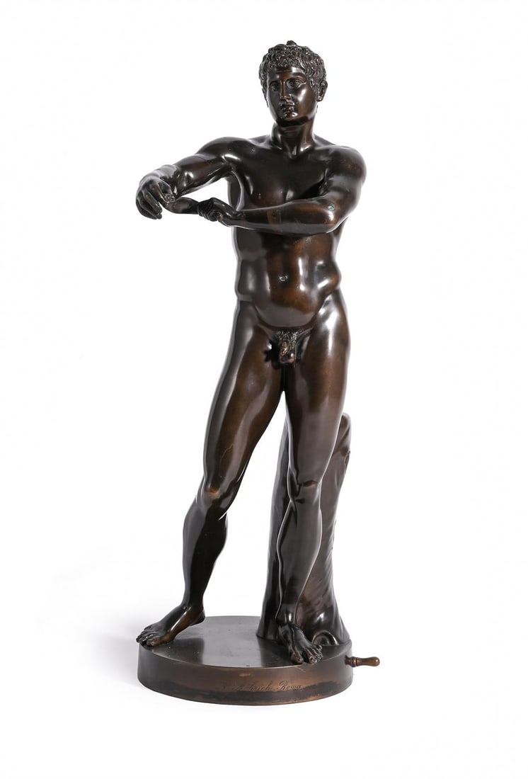 AFTER THE ANTIQUE, A BRONZE FIGURE OF APOXYOMENOS, CAST BY A. RÖHRICH, CIRCA 1840: AFTER THE ANTIQUE, A BRONZE FIGURE OF APOXYOMENOS CAST BY A. RÖHRICH, ROME, CIRCA 1840 Signed to the base 43.5cm high, the base 20.5cm diameter The original life size bronze statue of the Apoxyom