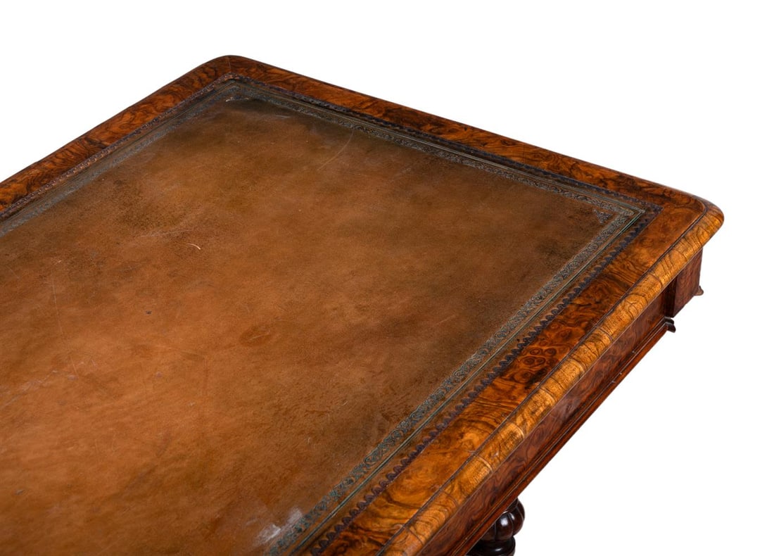 A VICTORIAN FIGURED WALNUT WRITING TABLE, IN THE MANNER OF HOLLAND AND SONS, CIRCA 1870 - 2