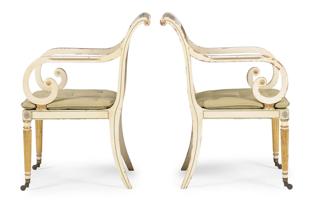 A PAIR OF PAINTED AND PARCEL GILT OPEN ARMCHAIRS, IN THE REGENCY STYLE, CIRCA 1900 - 3