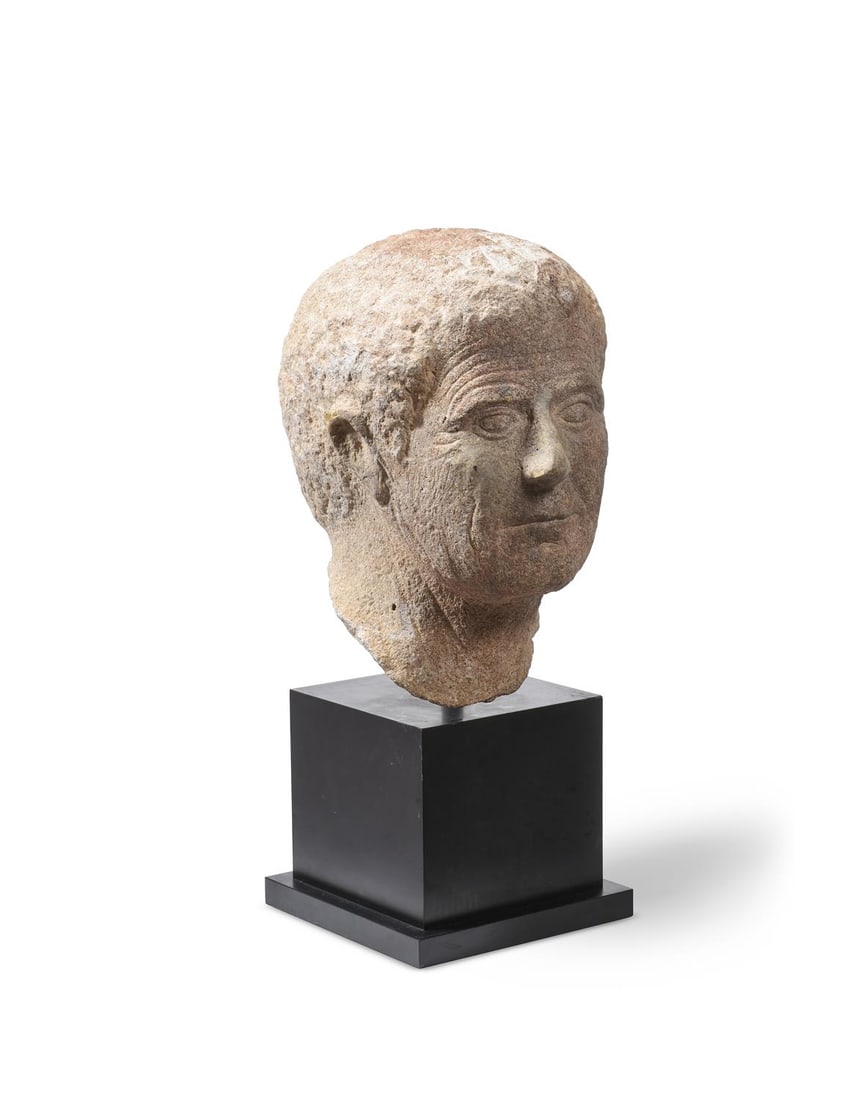 A CARVED MARBLE PORTRAIT HEAD OF A ROMAN MAN (1 of 3)