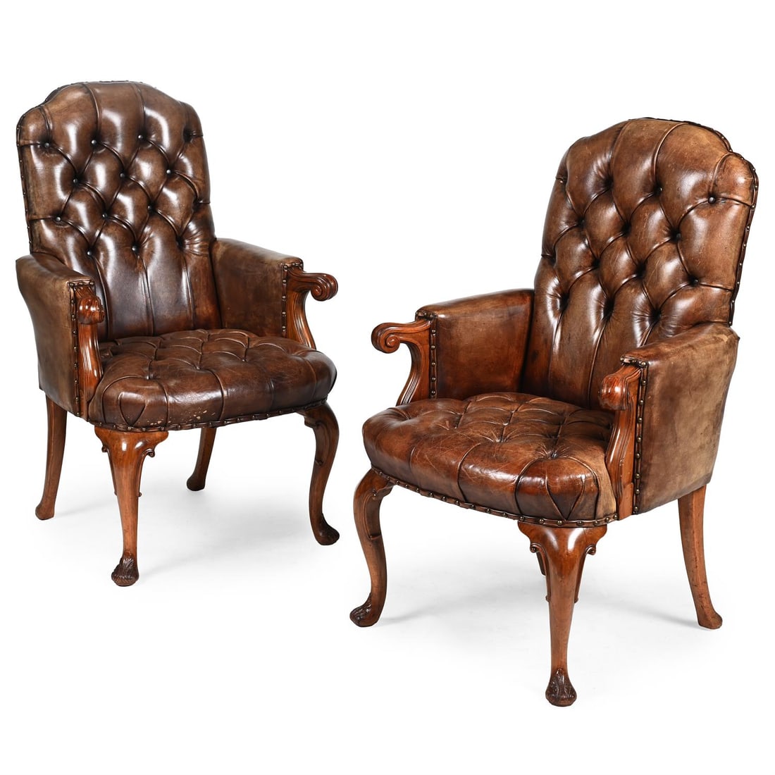 A PAIR OF WALNUT AND BUTTONED LEATHER UPHOLSTERED LIBRARY ARMCHAIRS, FIRST HALF 20TH CENTURY (1 of 3)