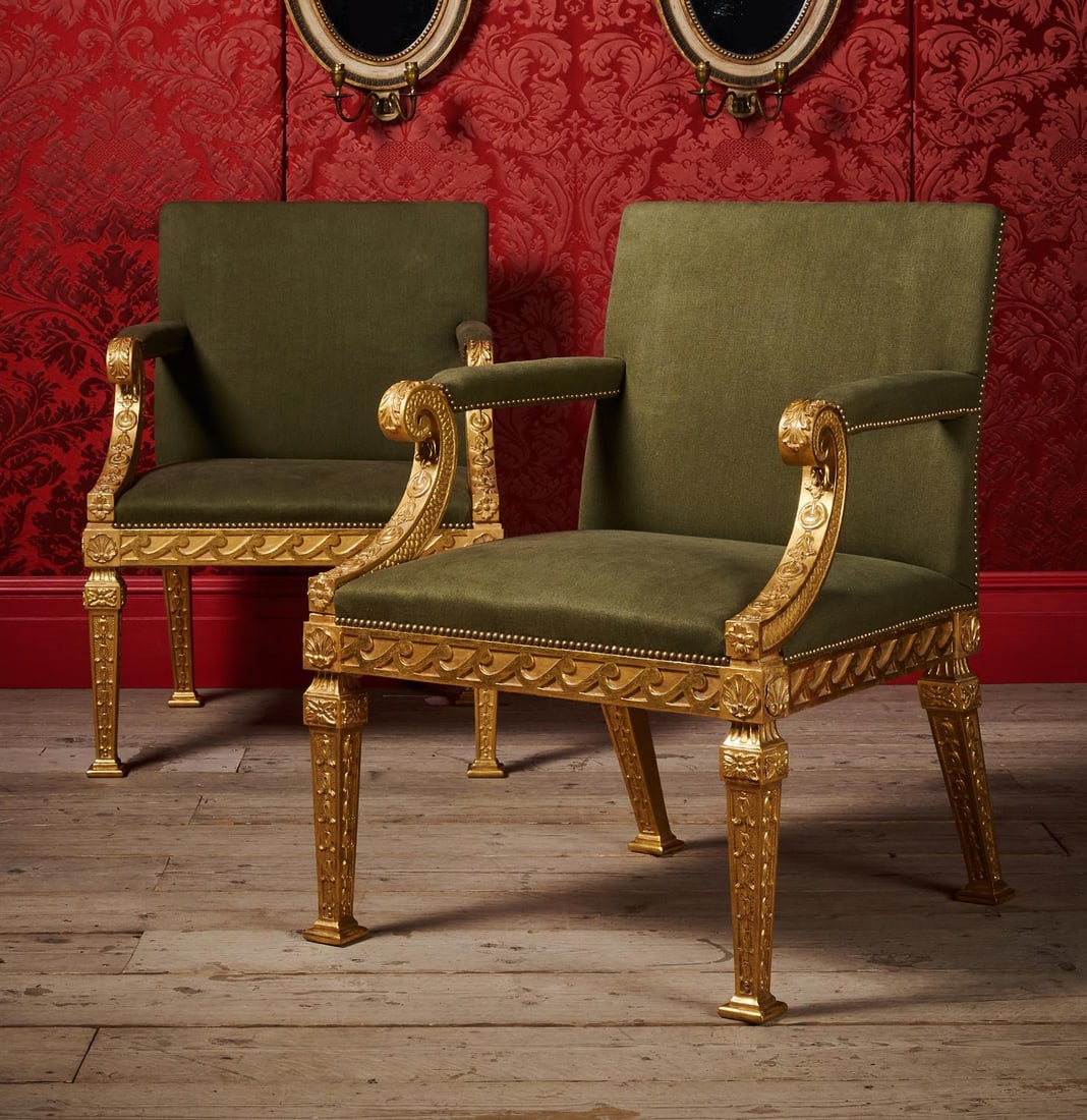 A PAIR OF CARVED GILTWOOD AND UPHOLSTERED ARMCHAIRS, IN GEORGE II STYLE, CONTEMPORARY: A PAIR OF CARVED GILTWOOD AND UPHOLSTERED ARMCHAIRSIN GEORGE II STYLE, IN THE MANNER OF WILLIAM KENT, CONTEMPORARY94cm high, 68cm wide, 70cm deep