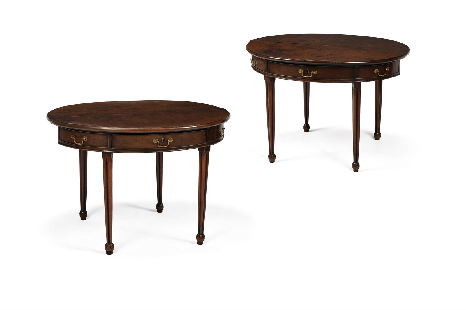 AN UNUSUAL PAIR OF GEORGE III 'FUSTIC' MAHOGANY FOLDING TEA TABLES, CIRCA 1790: AN UNUSUAL PAIR OF GEORGE III 'FUSTIC' MAHOGANY FOLDING TEA TABLESCIRCA 1790With a central drawer flanked by two false drawers75.5cm high, 106.5cm wide, 45.5cm deepThe use of the exotic wood called fu