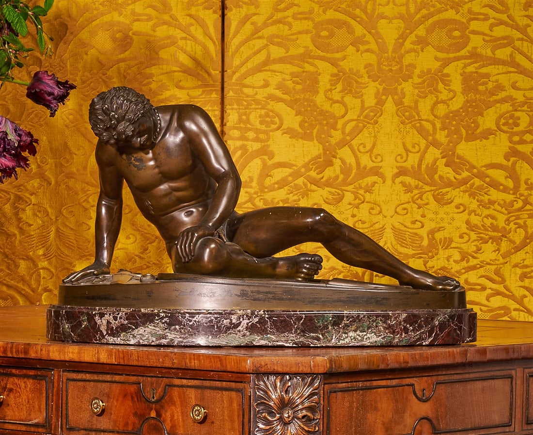 AFTER THE ANTIQUE, A LARGE BRONZE FIGURE OF THE DYING GAUL,19TH CENTURY: AFTER THE ANTIQUE, A LARGE BRONZE FIGURE OF THE DYING GAUL 19TH CENTURY In the manner of Giuseppe Caputi, on a marble plinth base 34cm high overall, the base 60cm wideThis bronze was cast after the An