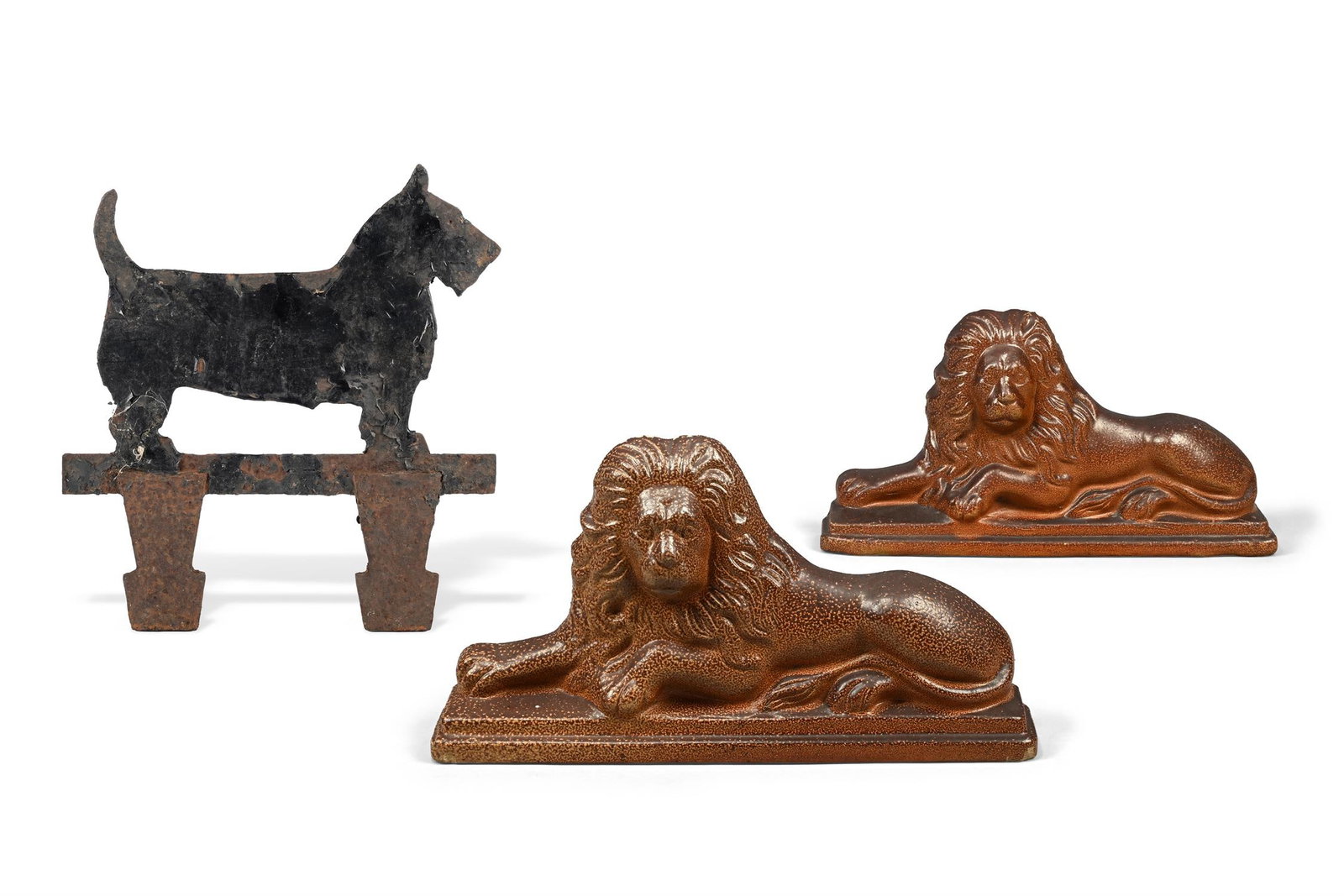 TWO SIMILAR BROWN SALT-GLAZED STONEWARE DOOR STOPS OR DOOR PORTERS MODELLED AS RECUMBENT LIONS (1 of 4)