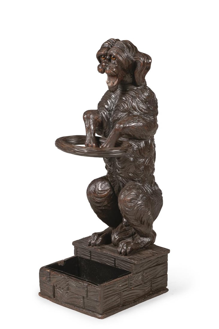 A BLACK FOREST CARVED LINDEN WOOD DOG STICK STAND, LATE 19TH CENTURY: A BLACK FOREST CARVED LINDEN WOOD DOG STICK STAND LATE 19TH CENTURY 104cm high, 41cm wide, 36cm deep