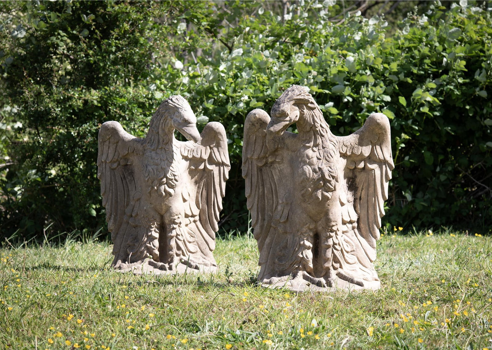 A LARGE PAIR OF COMPOSITION STONE EAGLES, 20TH CENTURY (1 of 3)