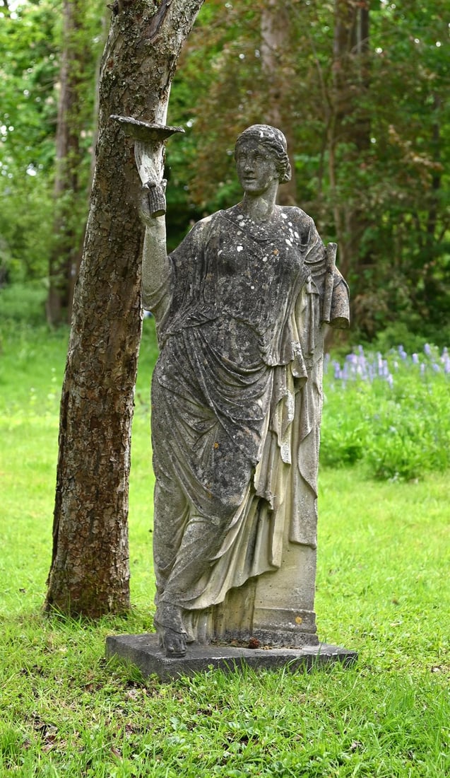 A COMPOSITION STONE FIGURE OF CLYTIE, MID TO EARLY 20TH CENTURY: A COMPOSITION STONE FIGURE OF CLYTIE MID TO EARLY 20TH CENTURY Depicted standing, holding a sunflower aloft 145cm high, the base 56 x 32cm