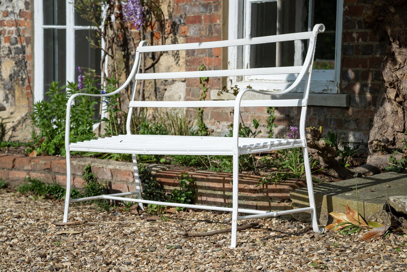 A REGENCY WHITE PAINTED STRAPWORK IRON BENCH, EARLY 19TH CENTURY (1 of 1)