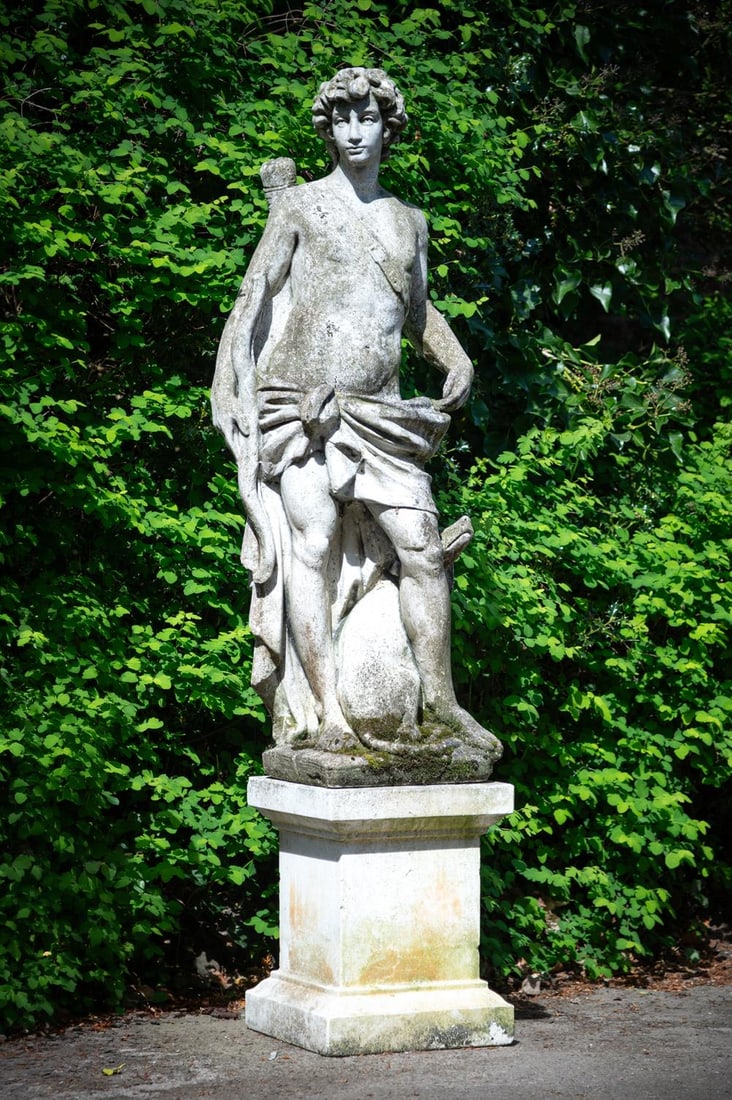 A LARGE COMPOSITION STONE FIGURE OF APOLLO AND HIS DOG ON BASE, 20TH CENTURY: A LARGE COMPOSITION STONE FIGURE OF APOLLO AND HIS DOG ON BASE 20TH CENTURY Apollo in the guise of a hunter, the base associated 191cm high overall, the base 40.5cm square