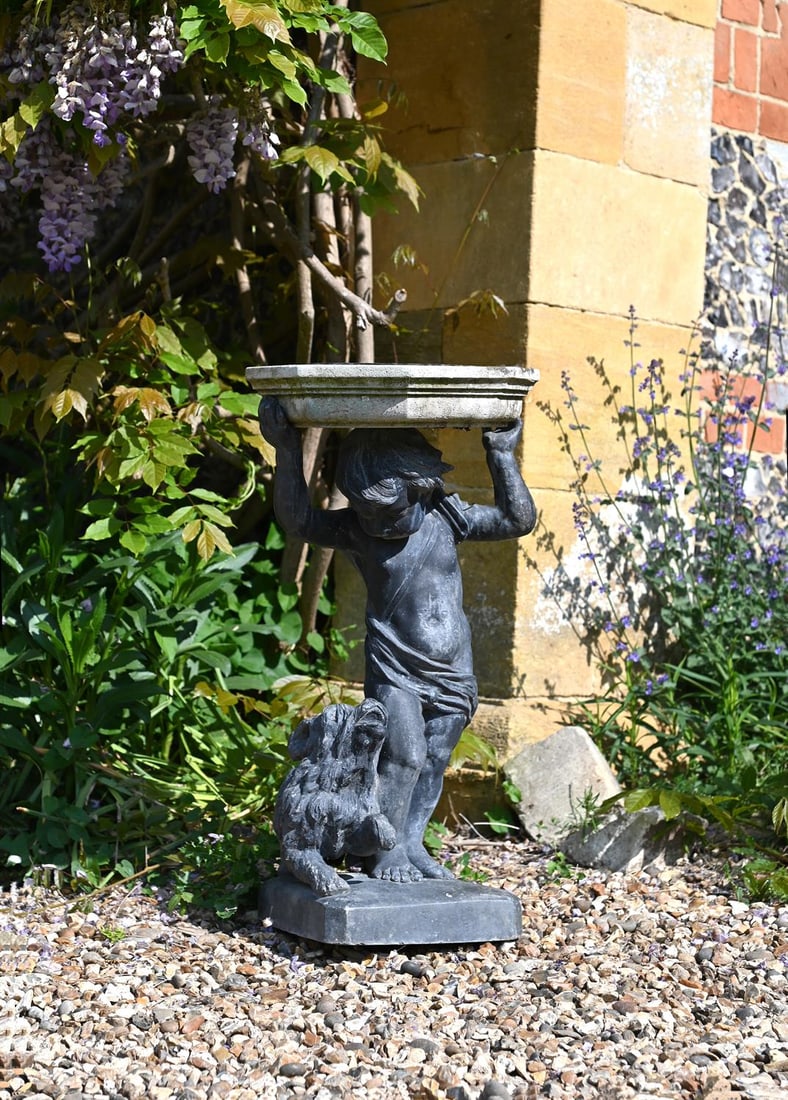 A LEAD FIGURE OF A BOY AND DOG SUPPORTING A PORTLAND STONE BIRD BATH, EARLY 20TH CENTURY (1 of 1)