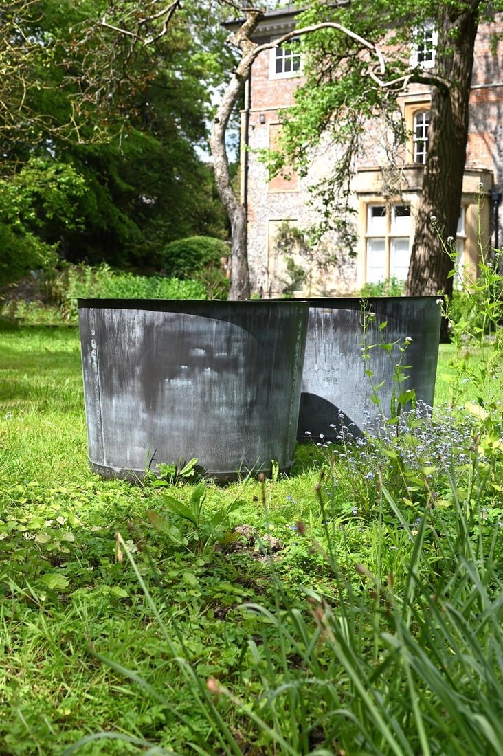 A LARGE PAIR OF PATINATED COPPER AND RIVETED CIRCULAR PLANTERS, CONTEMPORARY (1 of 1)