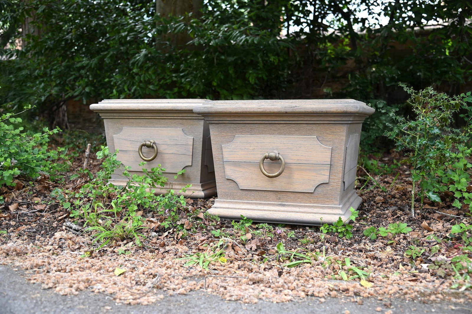 A PAIR OF LIMED OAK SQUARE PLANTERS, IN THE MANNER OF HEALS, 20TH CENTURY (1 of 1)