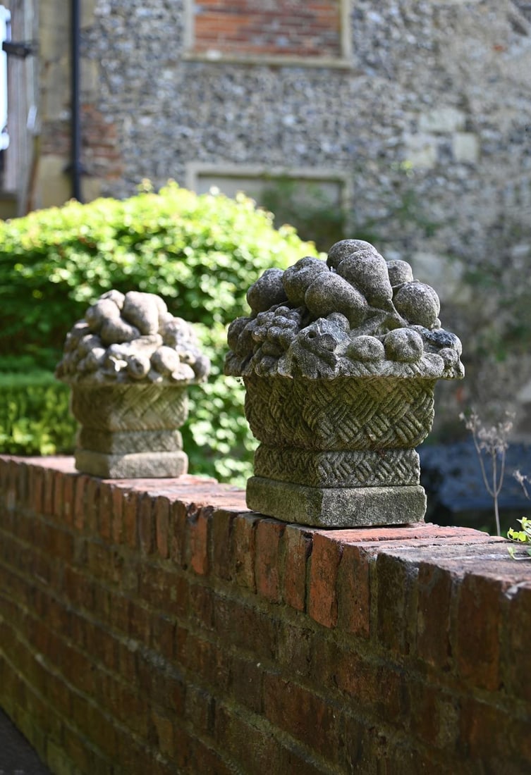 A PAIR OF CARVED LIMESTONE BASKETS OF FRUIT, LATE 19TH OR EARLY 20TH CENTURY (1 of 1)