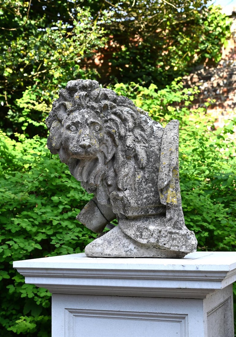 AFTER THE MODEL BY COADE, A COMPOSITION STONE LION, ATTRIBUTED TO AUSTIN & SEELEY, LATE 19TH CENTURY: AFTER THE MODEL BY COADE, A COMPOSITION STONE LION ATTRIBUTED TO AUSTIN & SEELEY, LATE 19TH CENTURY 64cm high, 52cm wide, 48cm deep