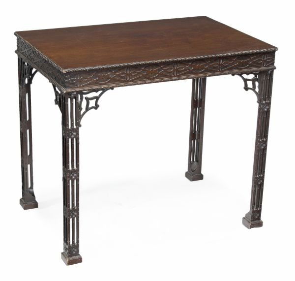 A mahogany silver table in George III style, last: A mahogany silver table in George III style, last quarter 19th century, rectangular top with gadrooned edge, blindfret decorated frieze, on pierced square section flowerhead carved legs, 72cm high, 81