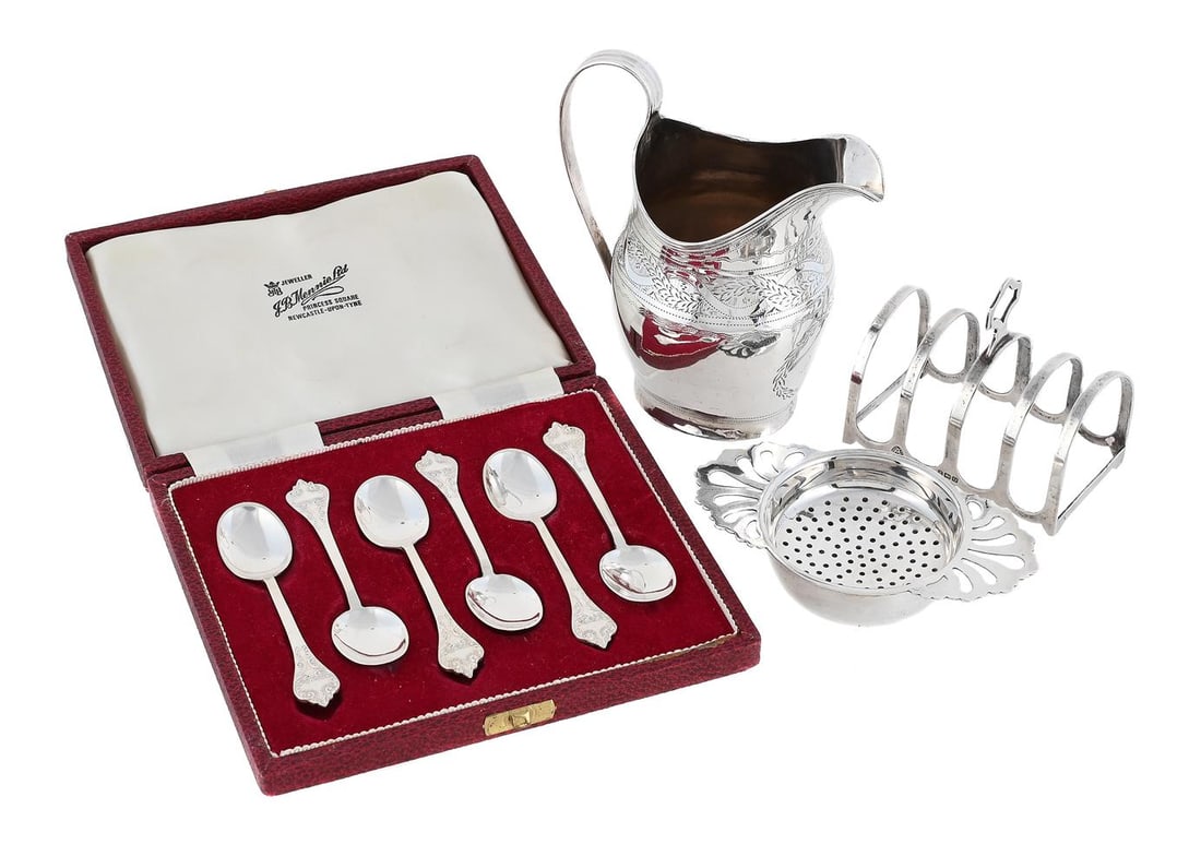 A GEORGE III SILVER OVAL CREAM JUG AND OTHER ITEMS: A GEORGE III SILVER OVAL CREAM JUG MAKER'S MARK OBSCURED, LONDON 1804 With a reeded border and high clip handle, engraved with an entwined foliate and scroll band, a monogram within a wreath 12cm