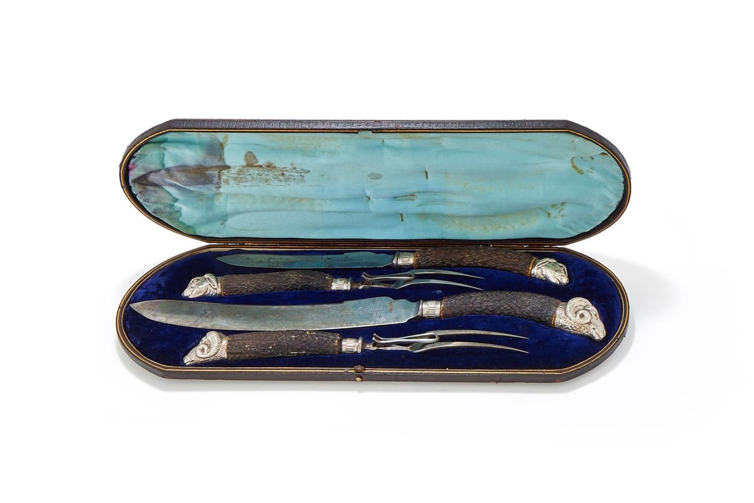 A CASED PAIR OF CARVING SETS - 2