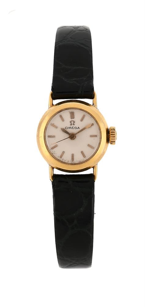 OMEGA, REF. 70832, A LADY'S 18 CARAT GOLD WRISTWATCH: OMEGA, REF. 70832 A LADY'S 18 CARAT GOLD WRISTWATCH, NO. 845462, BIRMINGHAM 1957 Movement: Cal. 455, automatic, 17 jewels Case: 18 carat gold case, snap case back Dial: Silvered Strap: Hirsch
