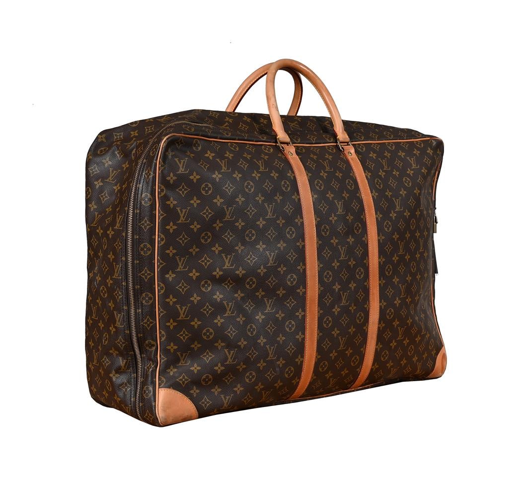 LOUIS VUITTON, MONOGRAM, A COATED CANVAS TRAVEL BAG: LOUIS VUITTON, MONOGRAM A COATED CANVAS TRAVEL BAG With twin leather loop handles, the zip fastener opening to a canvas interior with a pop button fastener and clothes straps 70 x 49 x 18cm