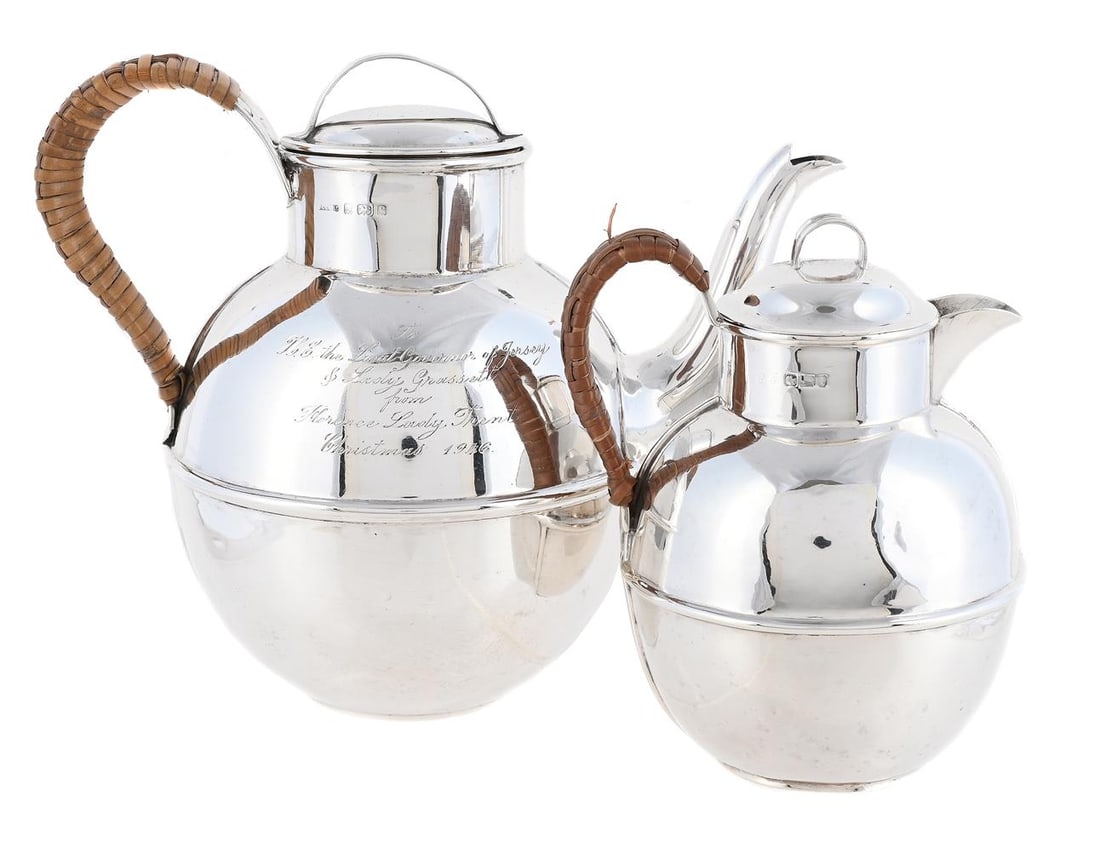 AN EDWARDIAN SILVER JERSEY CAN FORM TEA POT AND CREAM JUG: AN EDWARDIAN SILVER JERSEY CAN FORM TEA POT J. COLLYER & CO. LTD., BIRMINGHAM 1902 With a loop handle to the domed cover and a wicker wrapped scroll handle, engraved 'To H.E. the