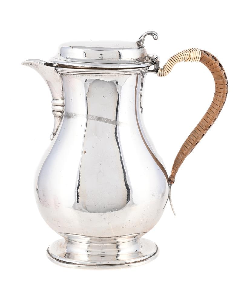 A SILVER OVAL BALUSTER SHAVING JUG (1 of 1)
